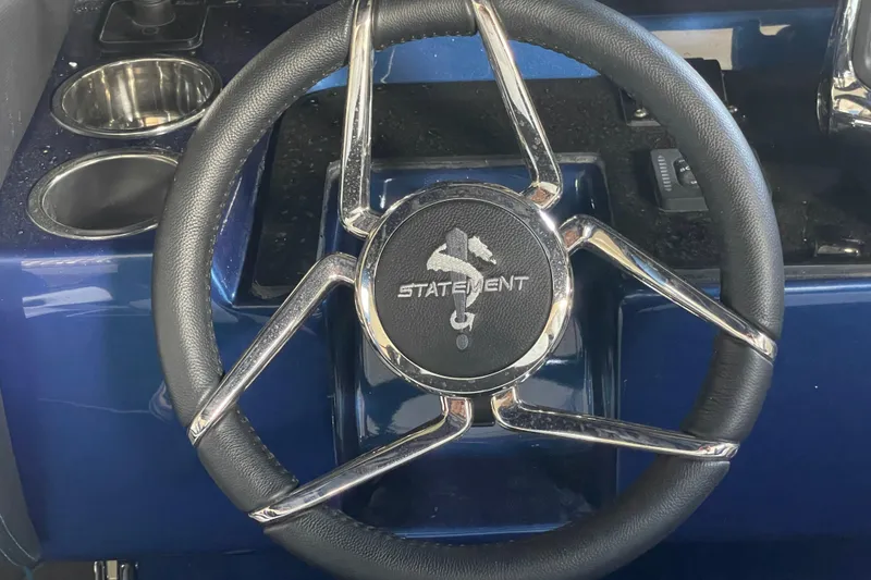 Slide: The Image of Steering wheel of 2027 Statement 350 Open boat with chrome accents. - 10