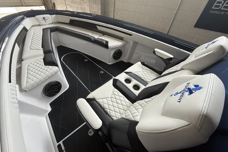 Slide: The Image of Luxurious interior of 2027 Statement 350 Open boat with quilted seating and cup holders. - 16