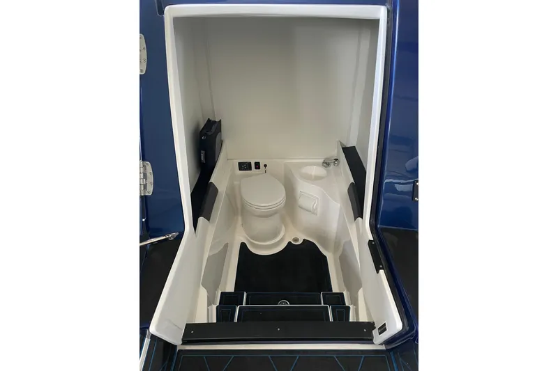 Slide: The Image of Interior view of 2027 Statement 350 Open boat's compact bathroom area. - 18