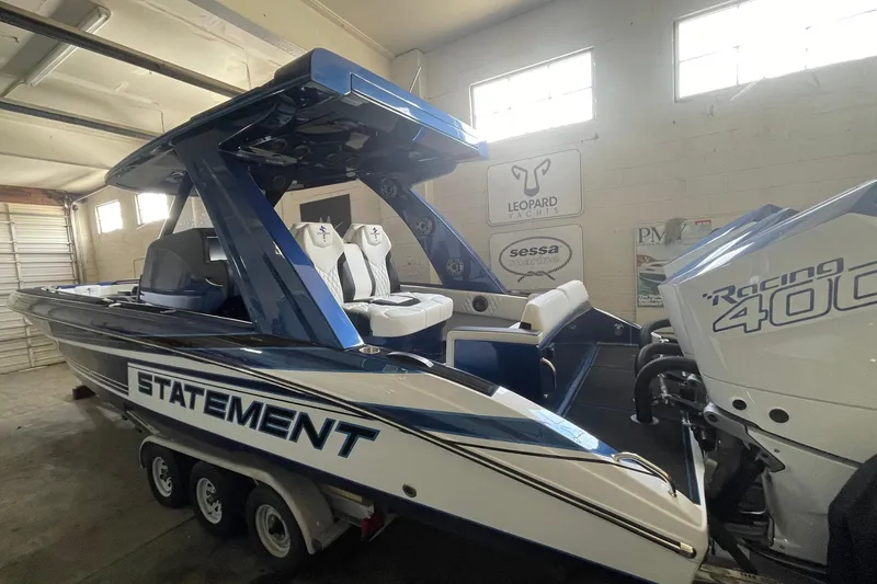 Slide: The Image of 2027 Statement 350 Open boat with Racing 400 engine in a garage setting. - 3