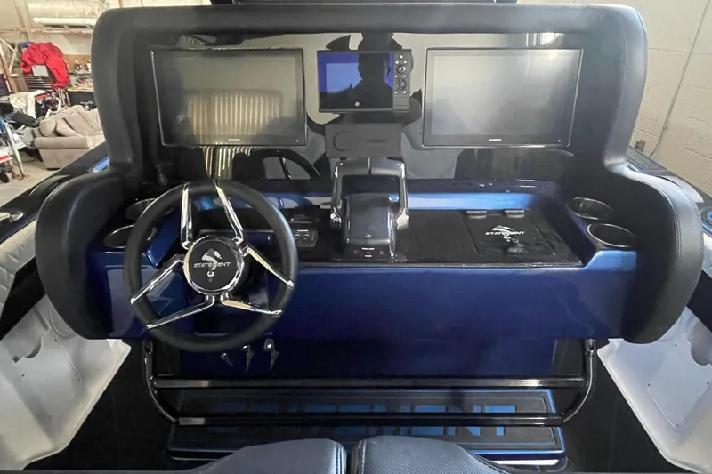 Slide: The Image of 2027 Statement 350 Open boat dashboard with dual screens and modern steering wheel. - 9