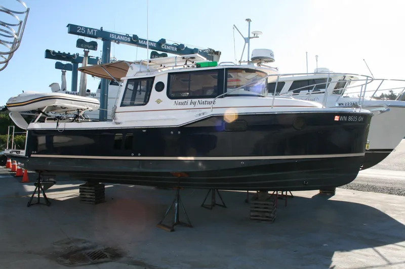 The Image of 2024 Ranger Tugs R-25 boat on dry dock at a marine center. - 0