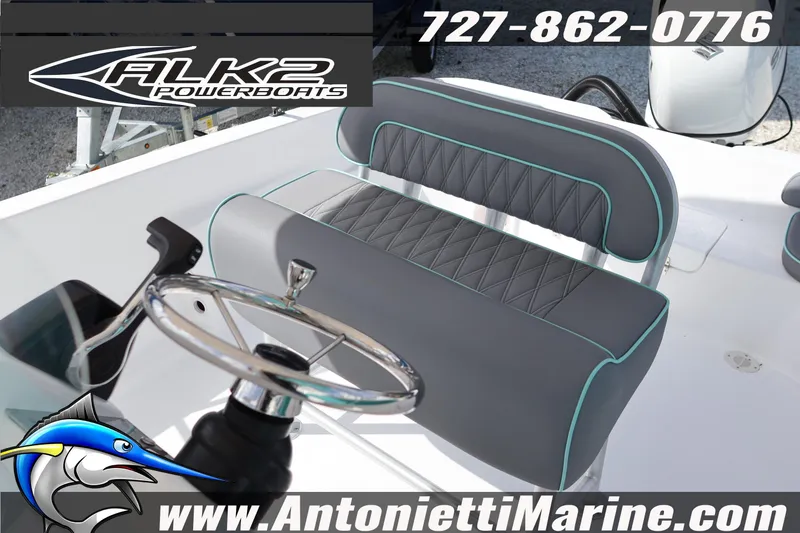 Slide: The Image of Steering area of 2026 ALK2 Powerboats 22 CRS with gray seating and teal accents. - 13