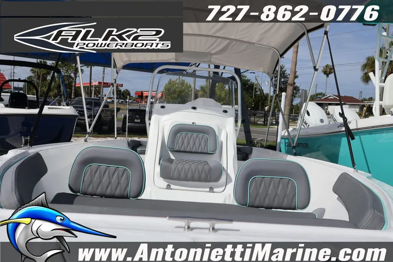 Slide: The Image of 2026 ALK2 Powerboats 22 CRS interior with seating, canopy, and marine branding. - 4