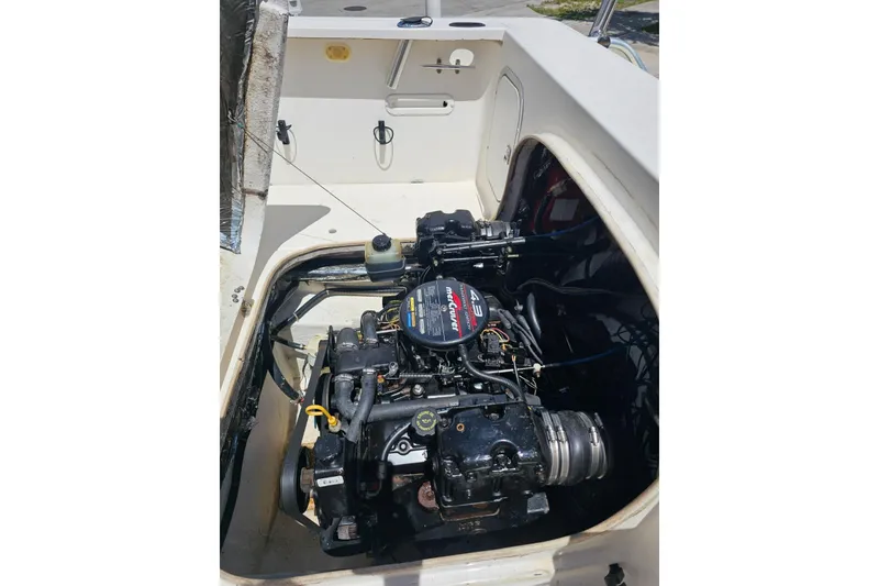Slide: The Image of 1999 Bayliner 1802 Trophy boat engine compartment with MerCruiser 4.3L motor. - 15