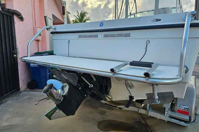Slide: The Image of 1999 Bayliner 1802 Trophy boat stern with outboard motor and swim platform. - 3