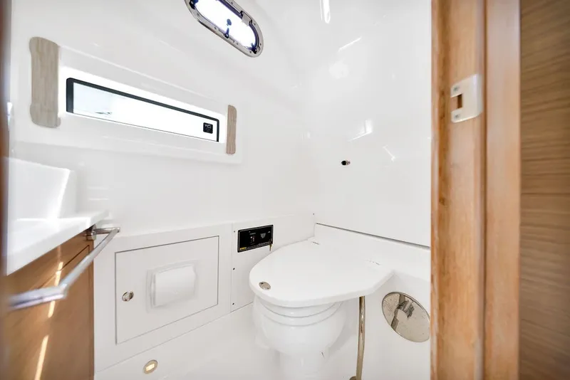 Slide: The Image of Luxurious bathroom interior of 2021 Pursuit S 378 Sport boat, featuring modern fixtures. - 38