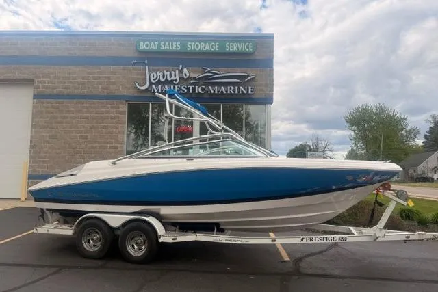 The Image of 2007 Regal 2200 Bowrider boat on trailer outside Jerry's Majestic Marine dealership. - 0