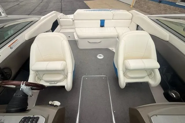 Slide: The Image of 2007 Regal 2200 Bowrider interior with white seating and steering wheel. - 15