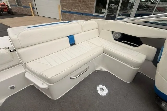 Slide: The Image of 2007 Regal 2200 Bowrider interior with white seating and blue accents. - 16
