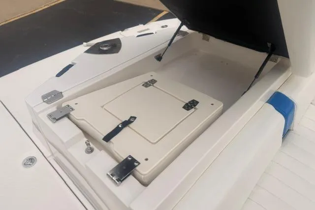 Slide: The Image of Open storage compartment on a 2007 Regal 2200 Bowrider boat. - 19