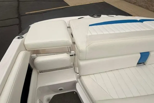 Slide: The Image of 2007 Regal 2200 Bowrider boat interior with white and blue seating. - 20