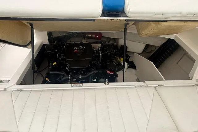 Slide: The Image of Engine compartment of a 2007 Regal 2200 Bowrider boat, showcasing the engine and interior details. - 23