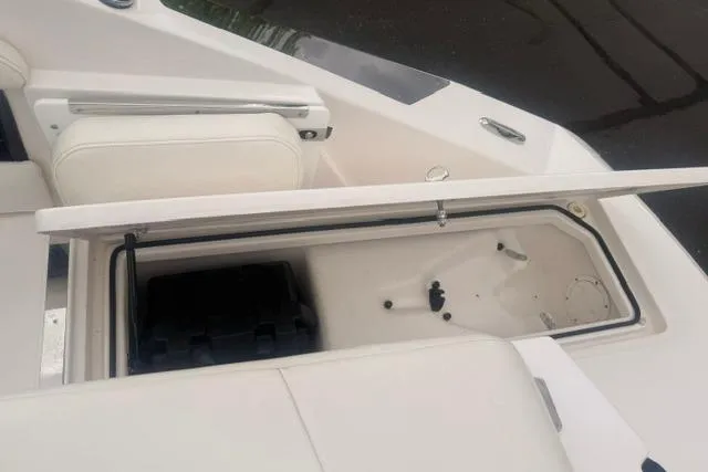 Slide: The Image of Open storage compartment on a 2007 Regal 2200 Bowrider boat. - 27