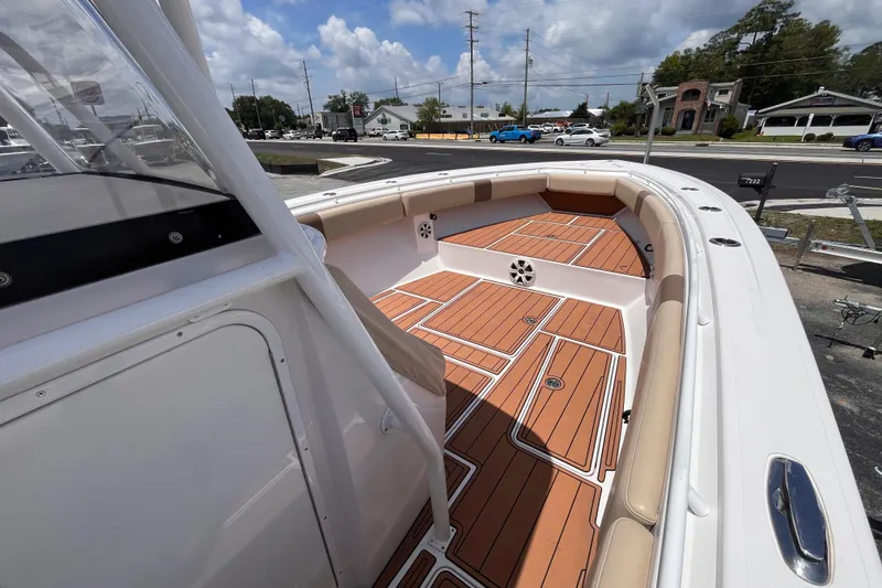 Slide: The Image of 2019 Fountain 38 Center Console boat with teak deck and cushioned seating. - 13