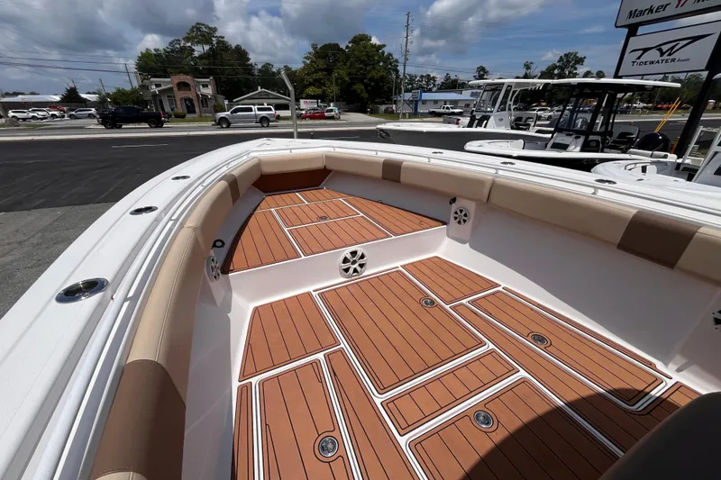 Slide: The Image of 2019 Fountain 38 Center Console boat with teak deck and cushioned seating. - 14