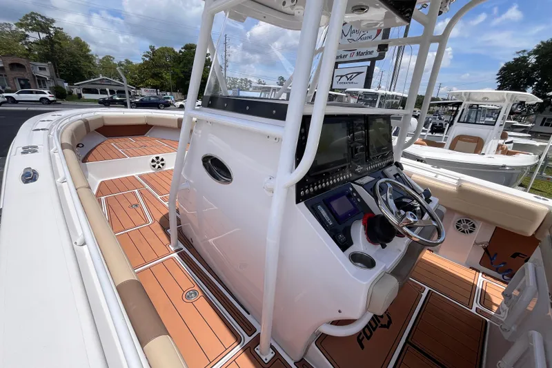 Slide: The Image of 2019 Fountain 38 Center Console boat with sleek design and modern dashboard. - 17