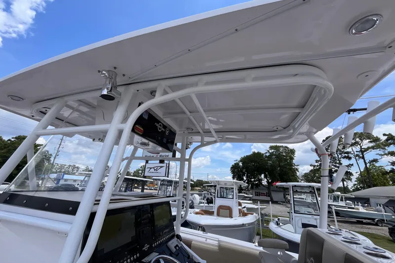 Slide: The Image of 2019 Fountain 38 Center Console boat interior with T-top and control panel. - 18