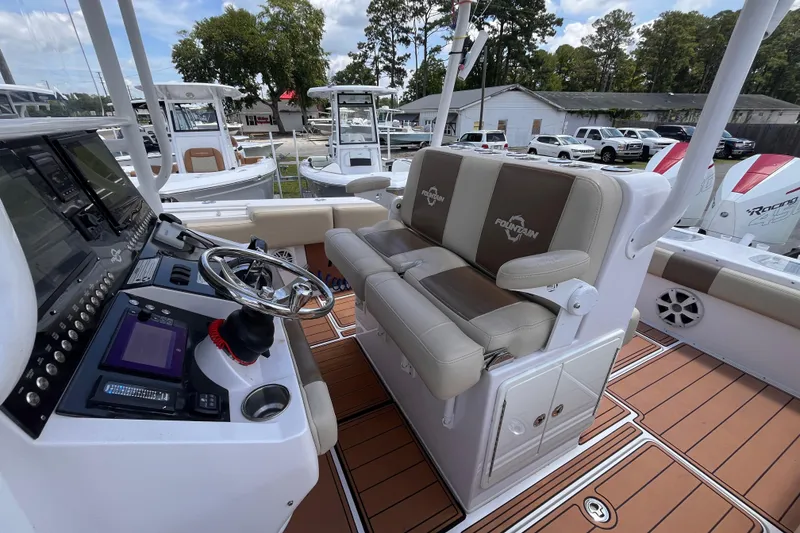 Slide: The Image of 2019 Fountain 38 Center Console boat interior with steering wheel and seating. - 19