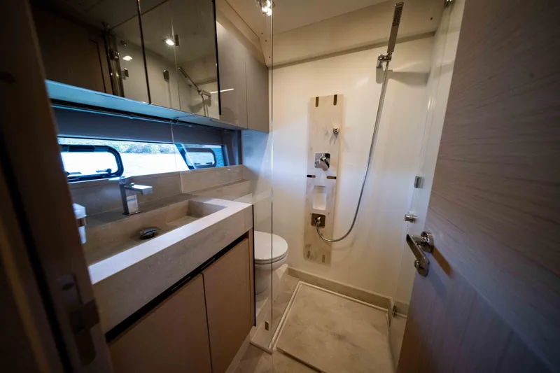 Slide: The Image of Modern bathroom interior in 2023 Prestige 520S yacht, featuring sleek fixtures and elegant design. - 12
