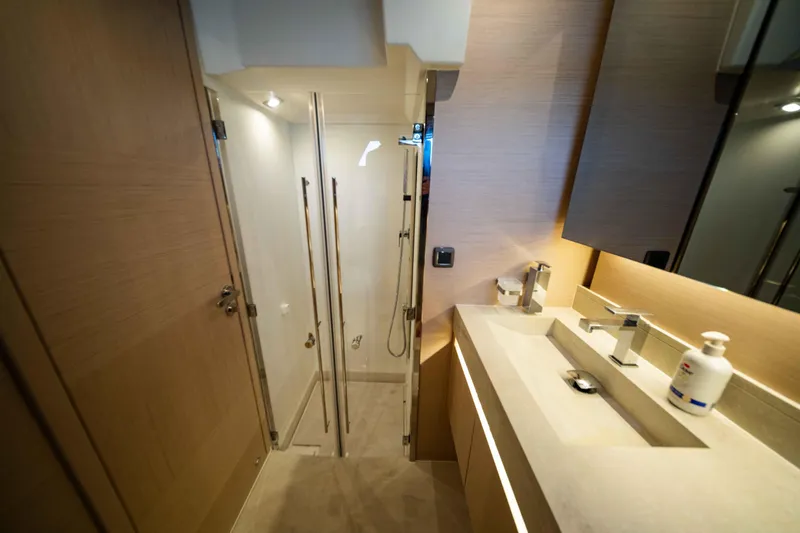 Slide: The Image of Luxurious bathroom in 2023 Prestige 520S yacht with modern fixtures and elegant design. - 15