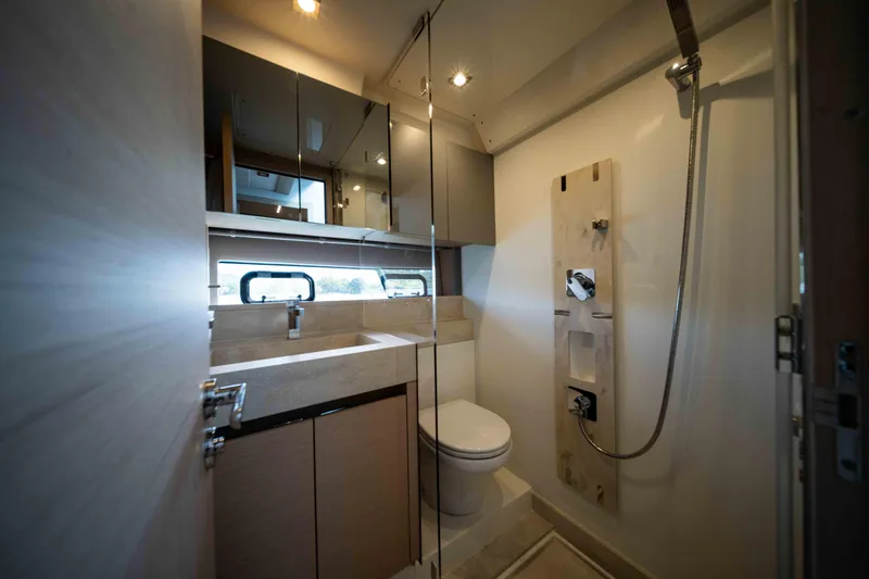 Slide: The Image of Luxurious bathroom interior of 2023 Prestige 520S yacht, featuring modern fixtures and elegant design. - 9