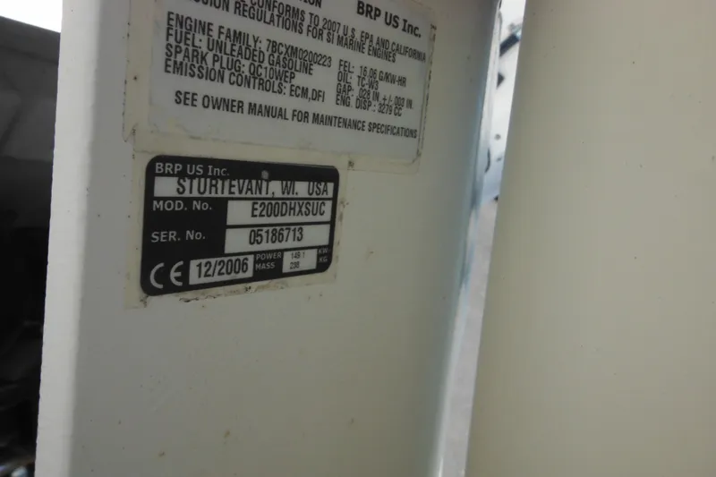 Slide: The Image of Label on a 1998 Wellcraft 23 Excel boat engine, showing model and serial numbers. - 10