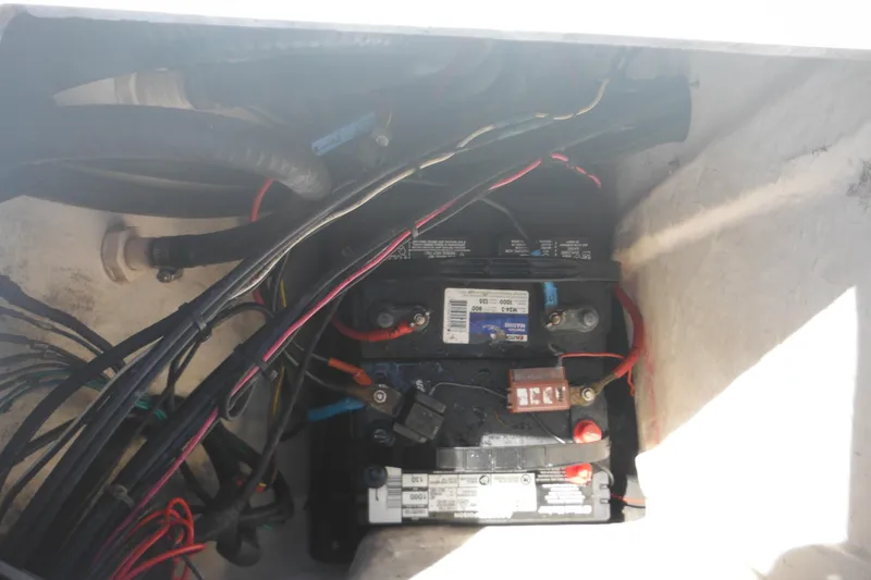 Slide: The Image of Battery compartment of a 1998 Wellcraft 23 Excel boat with wiring connections. - 18