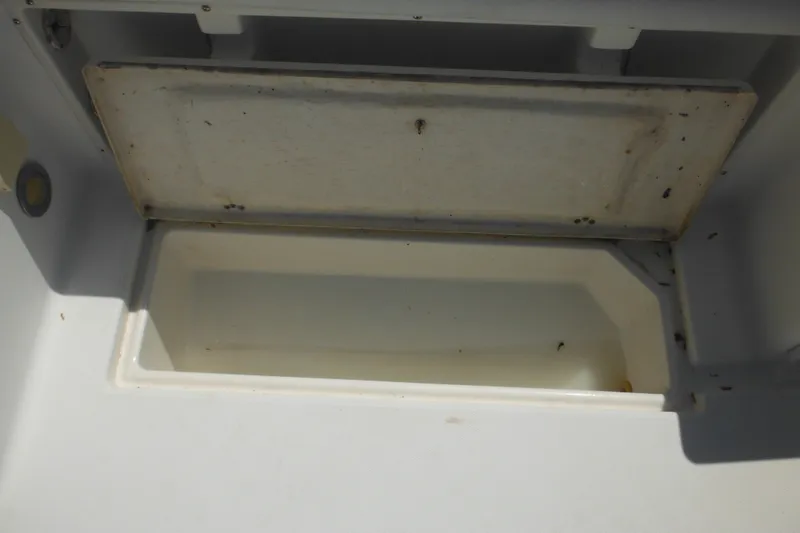 Slide: The Image of Open storage compartment on a 1998 Wellcraft 23 Excel boat. - 19