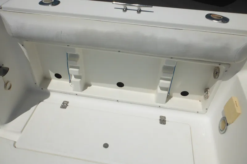 Slide: The Image of Interior view of a 1998 Wellcraft 23 Excel boat, showcasing seating and storage compartments. - 21