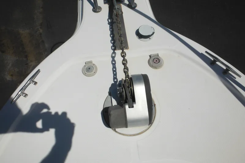 Slide: The Image of Bow of 1998 Wellcraft 23 Excel boat with anchor chain and winch. - 25