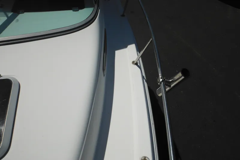 Slide: The Image of 1998 Wellcraft 23 Excel boat deck with railing and windshield. - 27