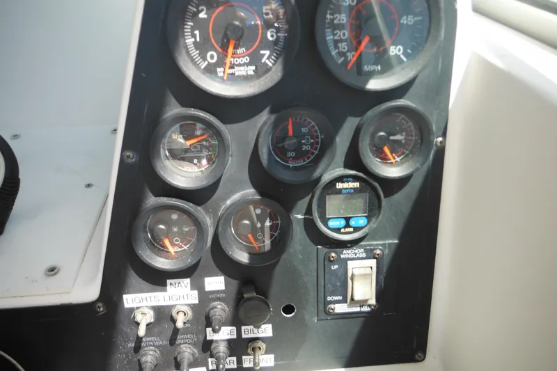 Slide: The Image of Dashboard of a 1998 Wellcraft 23 Excel boat with gauges and controls. - 33