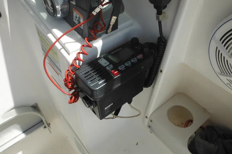 Slide: The Image of VHF radio installed on a 1998 Wellcraft 23 Excel boat dashboard. - 34