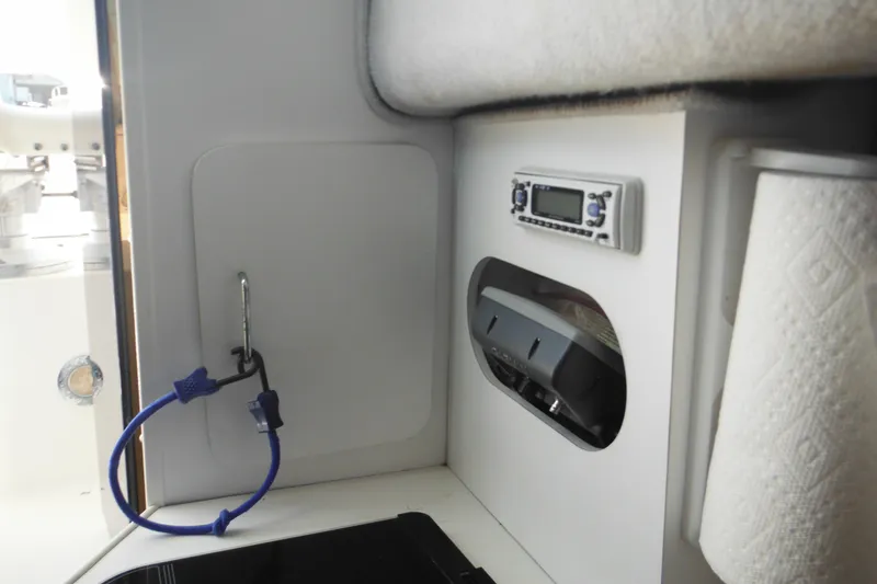 Slide: The Image of Interior of 1998 Wellcraft 23 Excel boat with radio and paper towel holder. - 39