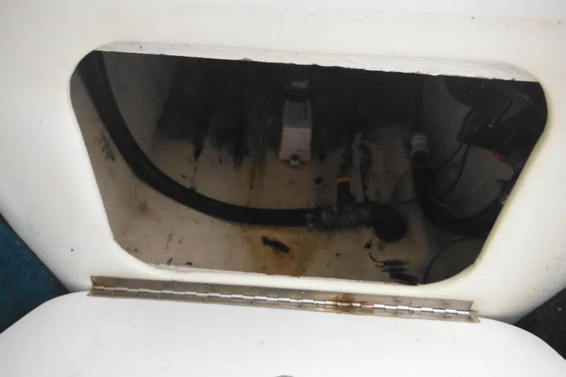 Slide: The Image of Open compartment of a 1998 Wellcraft 23 Excel boat showing interior components. - 41