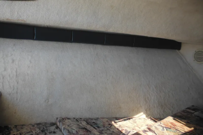 Slide: The Image of Interior cabin of a 1998 Wellcraft 23 Excel boat with patterned cushions. - 42