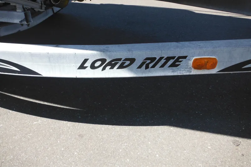 Slide: The Image of Trailer with "Load Rite" branding for 1998 Wellcraft 23 Excel boat. - 48