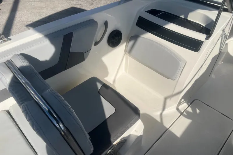 Slide: The Image of 2023 Bayliner VR5 Bowrider OB interior seating and storage area. - 11