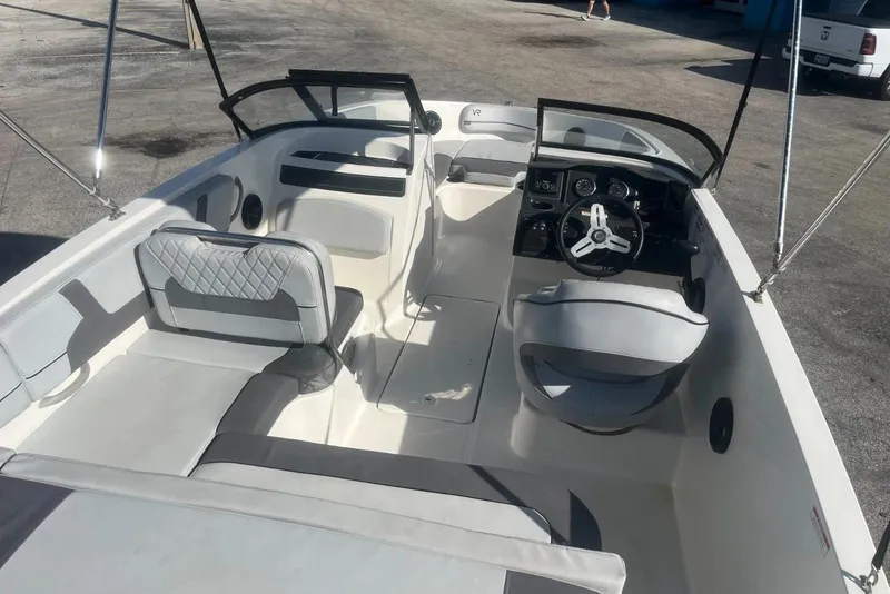 Slide: The Image of 2023 Bayliner VR5 Bowrider OB interior with seating and steering wheel. - 7