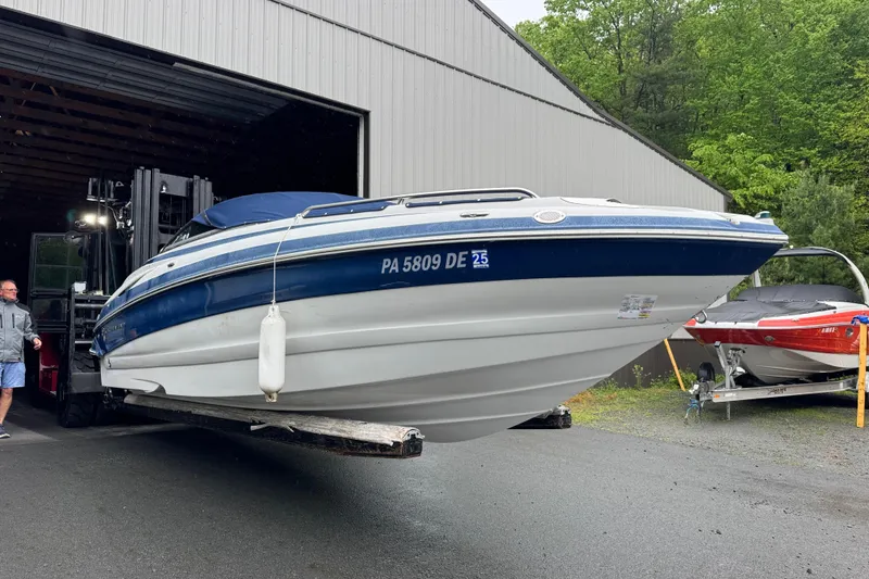 Slide: The Image of 2009 Crownline 240 LS boat being moved from storage facility. - 4
