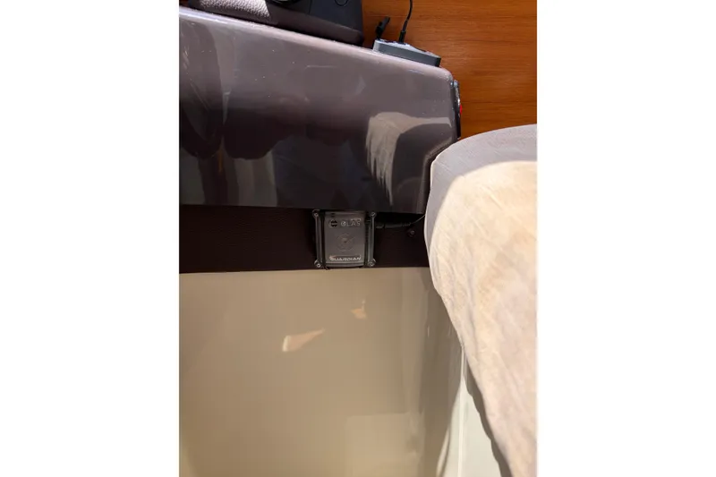 Slide: The Image of Interior detail of a 2021 Ranger Tugs R-27 boat, featuring a secure latch mechanism. - 10