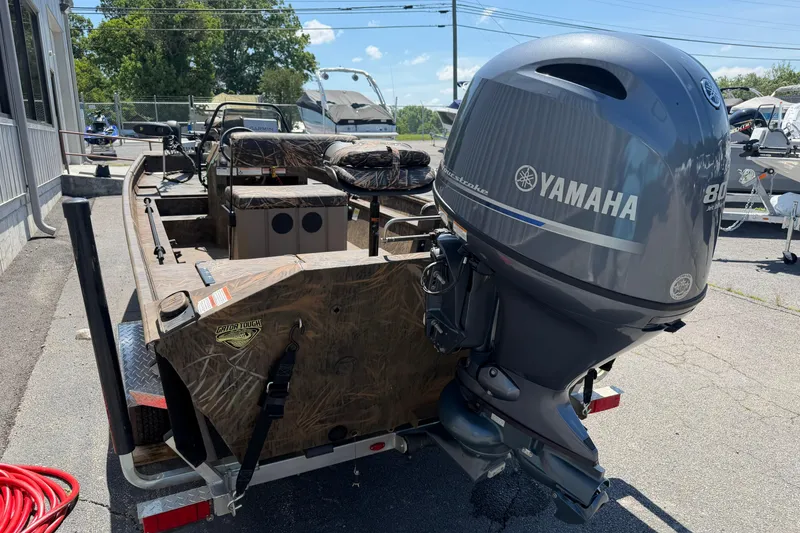 Slide: The Image of 2023 G3 Gator Tough 18 CCJ boat with Yamaha outboard motor, parked outdoors. - 7