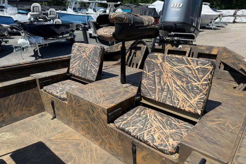 Slide: The Image of 2023 G3 Gator Tough 18 CCJ boat with camouflage seating and Yamaha motor. - 9