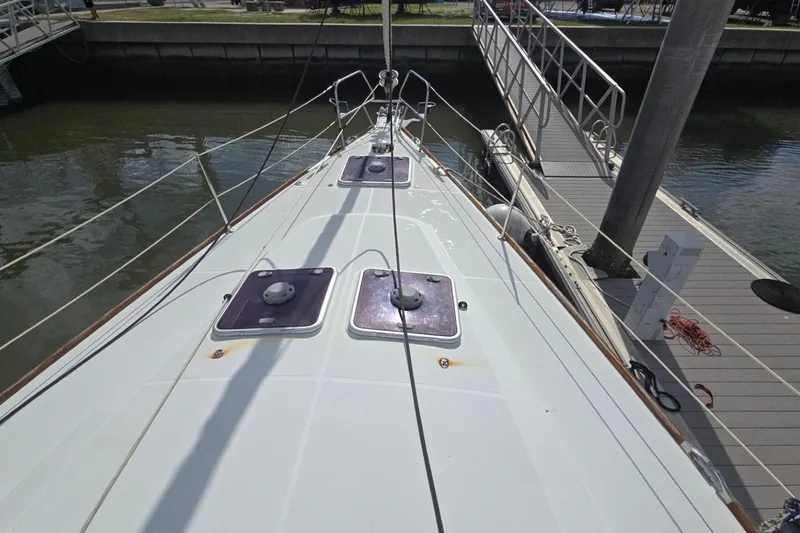 Slide: The Image of Deck view of 2011 Jeanneau Sun Odyssey 50 DS yacht docked at marina. - 11