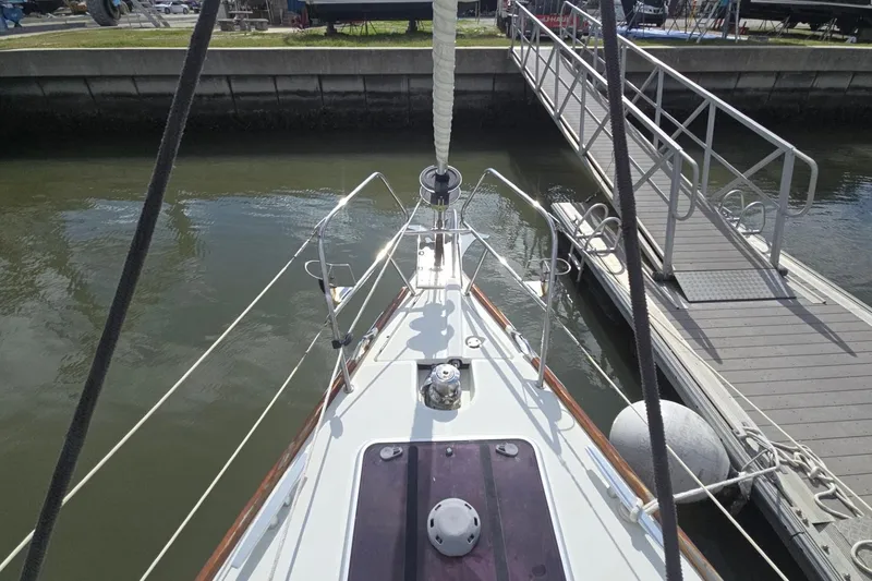 Slide: The Image of Bow view of 2011 Jeanneau Sun Odyssey 50 DS docked at marina. - 12