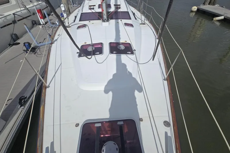 Slide: The Image of 2011 Jeanneau Sun Odyssey 50 DS sailboat deck view at marina. - 13