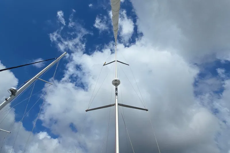 Slide: The Image of Mast of 2011 Jeanneau Sun Odyssey 50 DS sailboat against cloudy sky. - 15