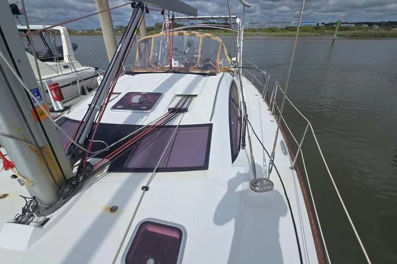 Slide: The Image of 2011 Jeanneau Sun Odyssey 50 DS sailboat docked, showcasing deck and rigging details. - 17