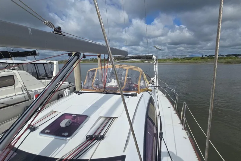 Slide: The Image of 2011 Jeanneau Sun Odyssey 50 DS sailboat docked on a cloudy day. - 18